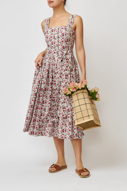 Dress with straps, made of cotton with a print of small flowers on white