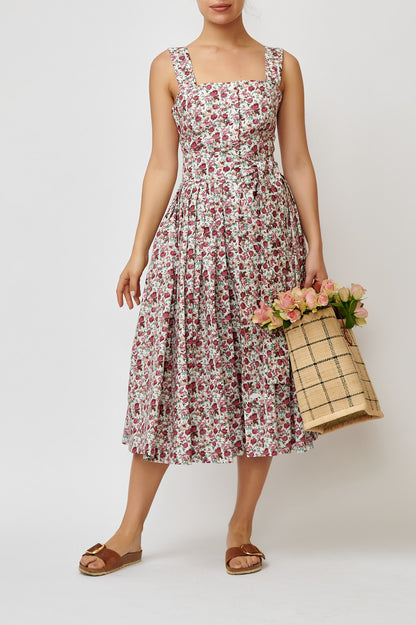 Dress with straps, made of cotton with a print of small flowers on white