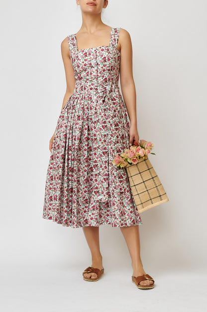 Dress with straps, made of cotton with a print of small flowers on white