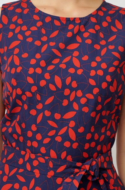 Sleeveless poplin dress with cherries on navy blue